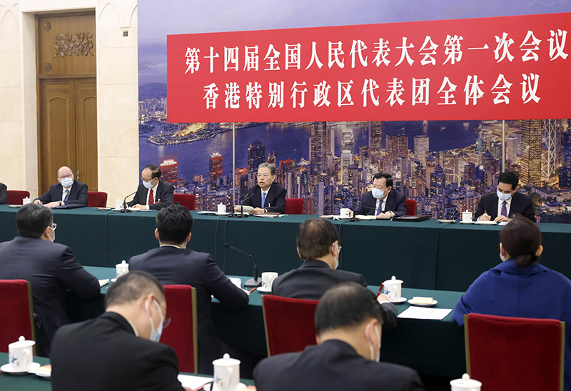 赵乐际分别参加香港代表团澳门代表团审议