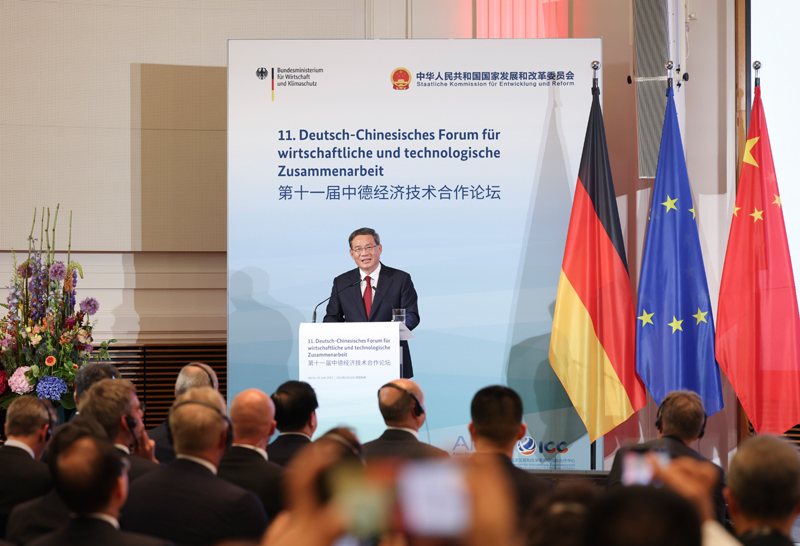 李强同德国总理朔尔茨共同出席第十一届中德经济技术合作论坛和中德企业家圆桌会